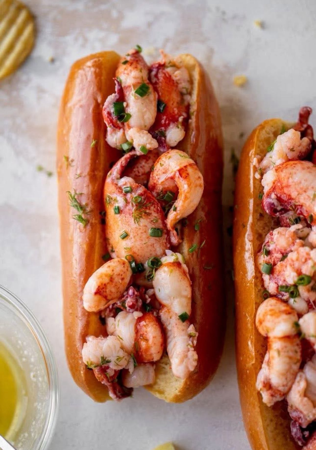  LOBSTA ROLLS with warm butter on a split top brioche.