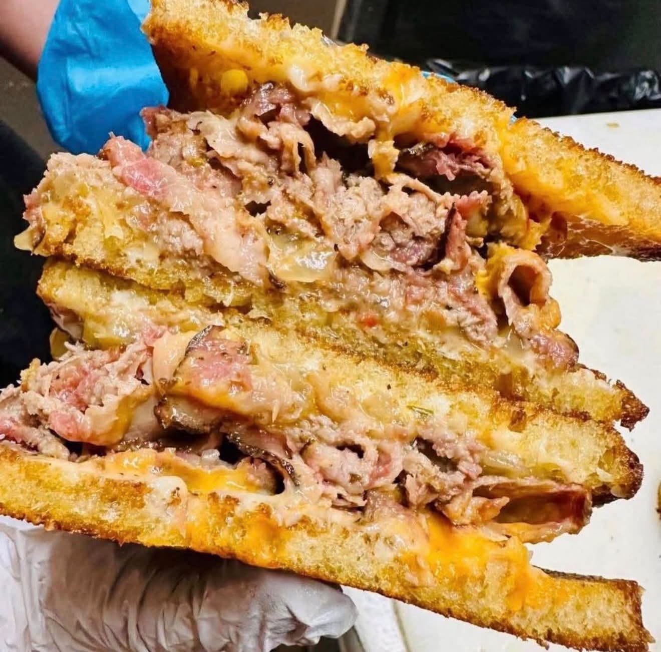 Sliced smoked brisket, melted cheese, caramelized onions, creamy BBQ sauce, on grilled Texas Toast